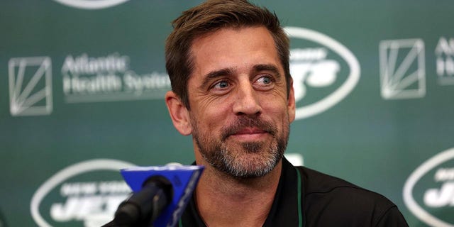 Aaron Rodgers talks to the reporters